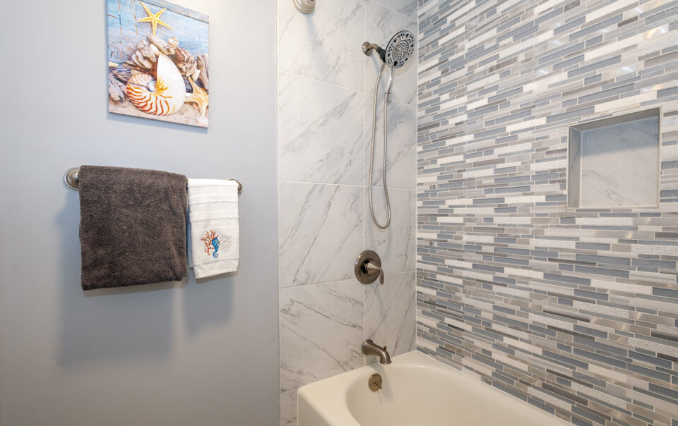 Modern bathroom with stylish tile and fixtures.