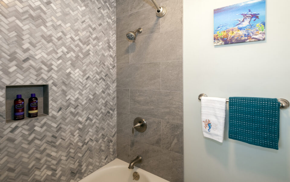 Modern shower with textured tile design.
