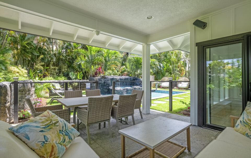 Relaxing patio area with pool view.