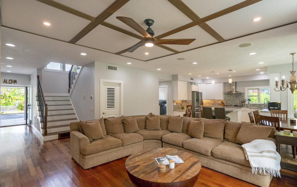 Spacious living area with modern furnishings and decor.