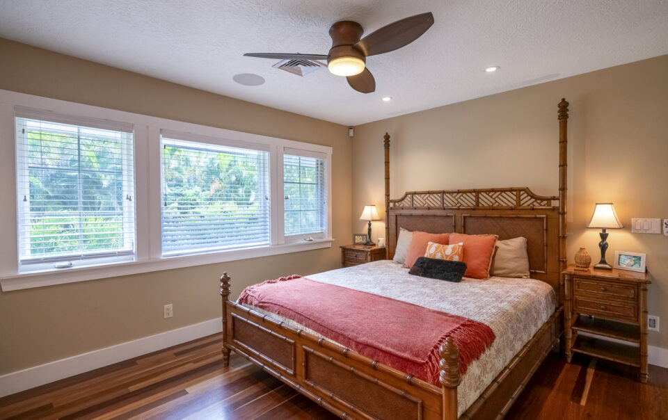 Tropical-inspired bedroom with wooden furniture accents.