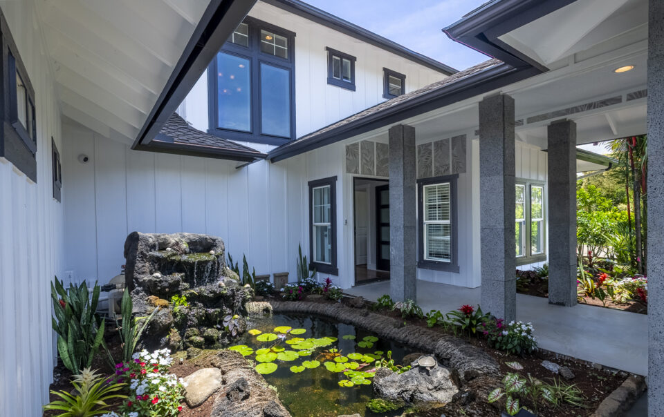 Tranquil courtyard with water feature and plants.