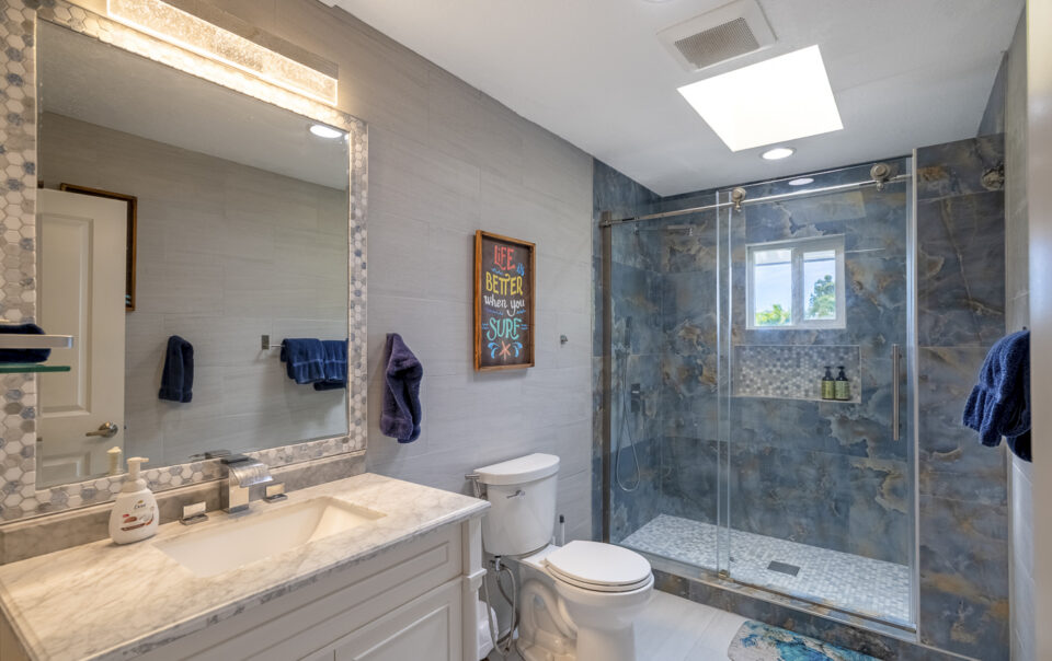 Modern bathroom with stylish glass shower enclosure.