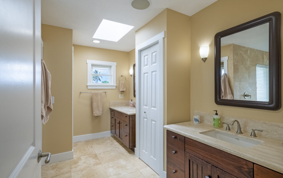 Bright bathroom with natural light and wood accents.
